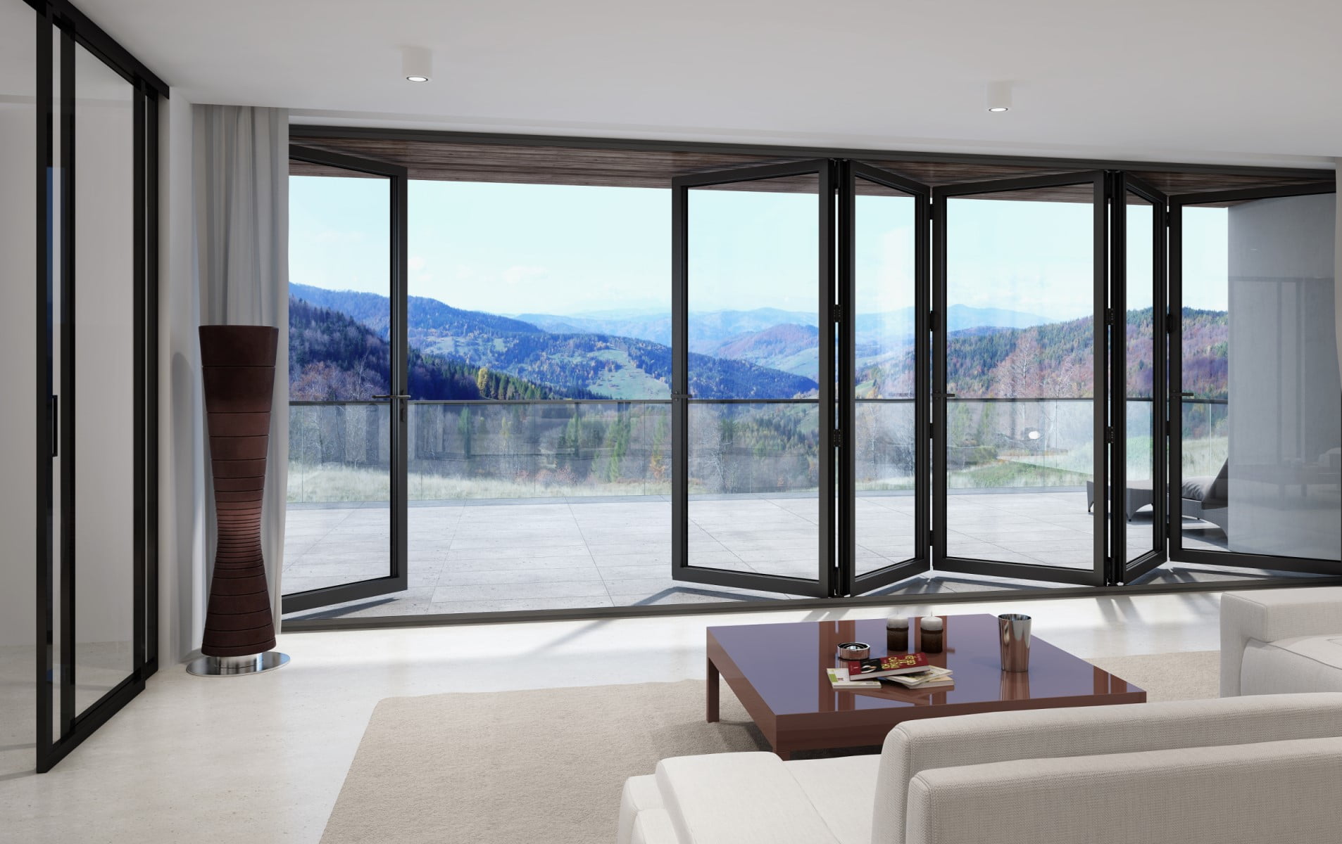 Binnenaanzicht van zwarte aluminium vouwwand (MB-86) met uitzicht op balkon en berglandschap – Toelevering Online